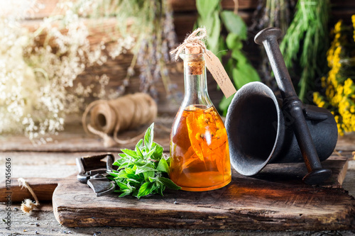 Therapeutic tincture in bottles made of honey and mint leaf