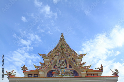 Wallpaper Mural Wat Pariwat Temple showed imeginary king of god statue at church gable with blue sky background Torontodigital.ca