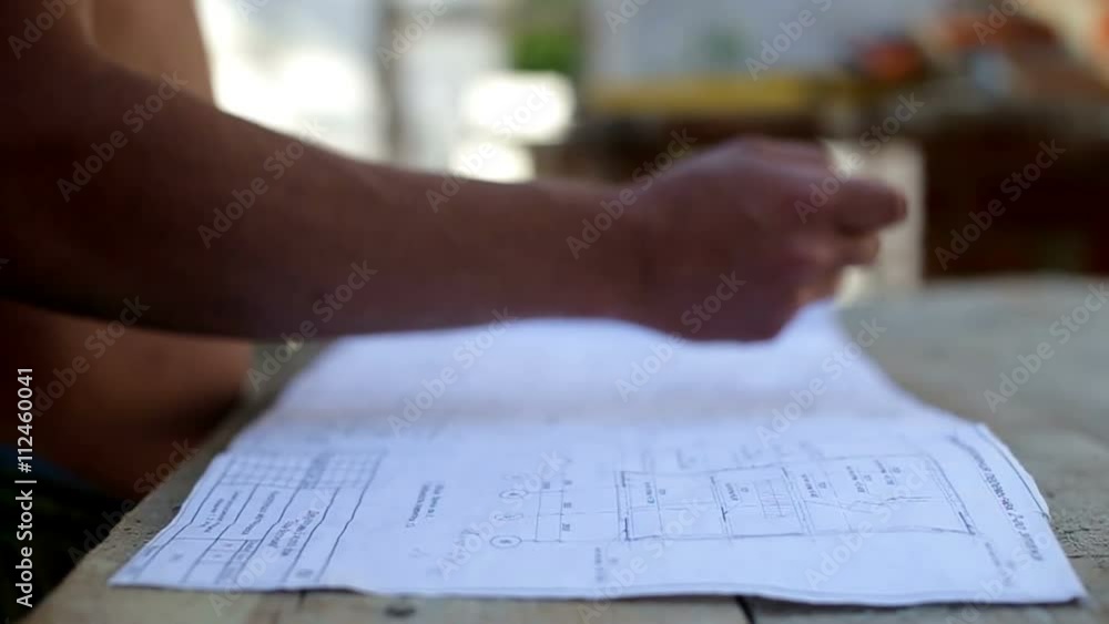 Work studying drawing at a construction site Work studying drawing at a construction site