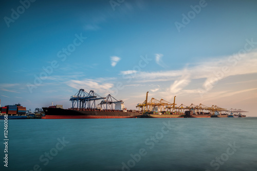 Cargo ship at Trade Port harbor with crane © sorapop