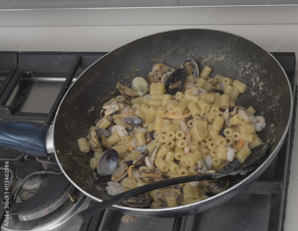 Pasta with seafood. Ingredients ad procedure. Italian cusine. Italian Style Pasta with seafood. Ingredients ad procedure. Italian cusine. Italian Style