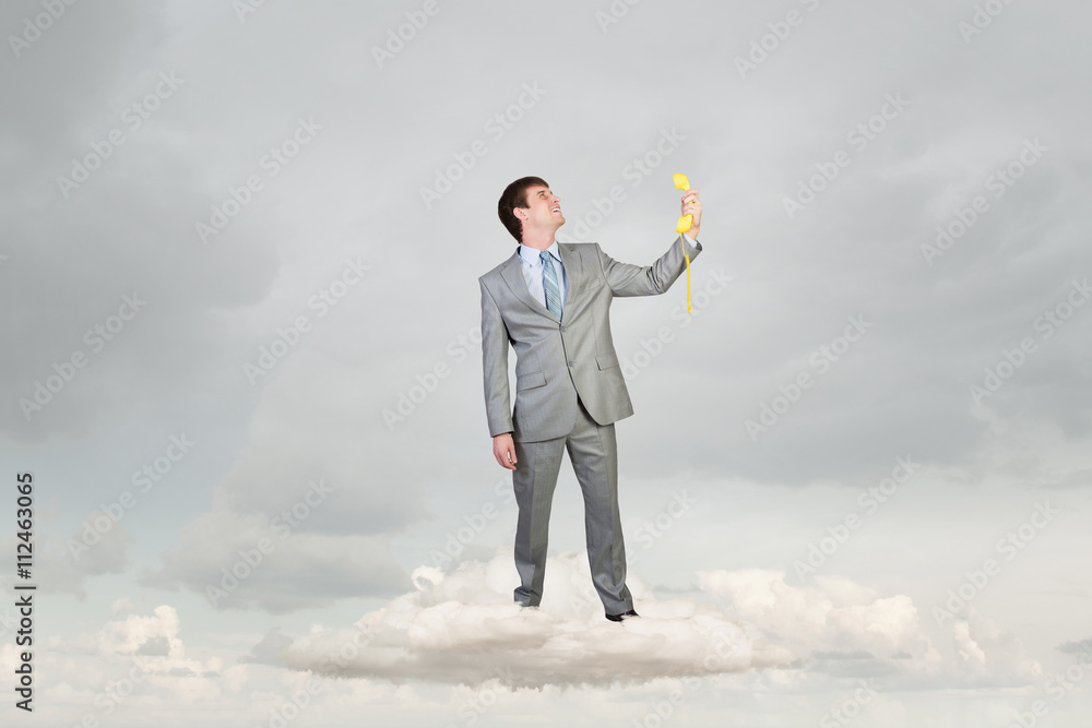 Businessman with yellow receiver Businessman with yellow receiver