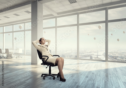 Businesswoman having rest in office