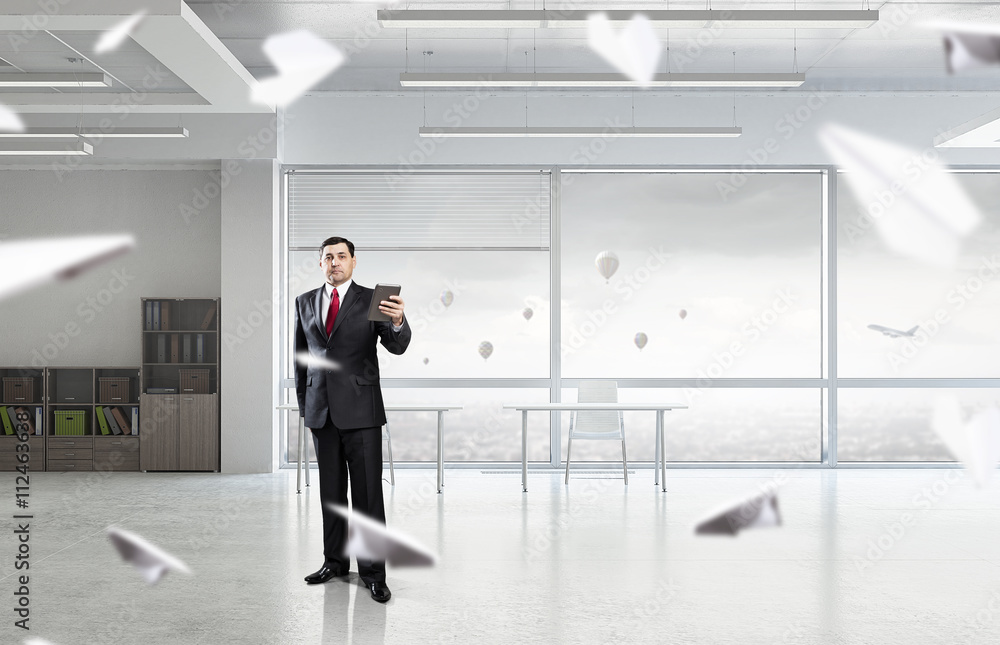 Businessman with tablet in hand Businessman with tablet in hand