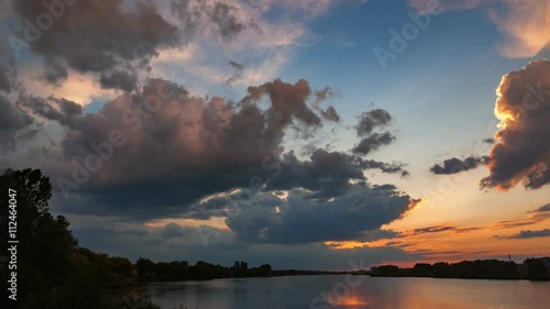 Sunset with rain over the lake. Time Lapse 