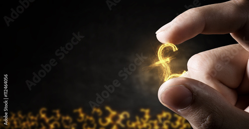 Money symbol between fingers photo