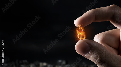 Money symbol between fingers
