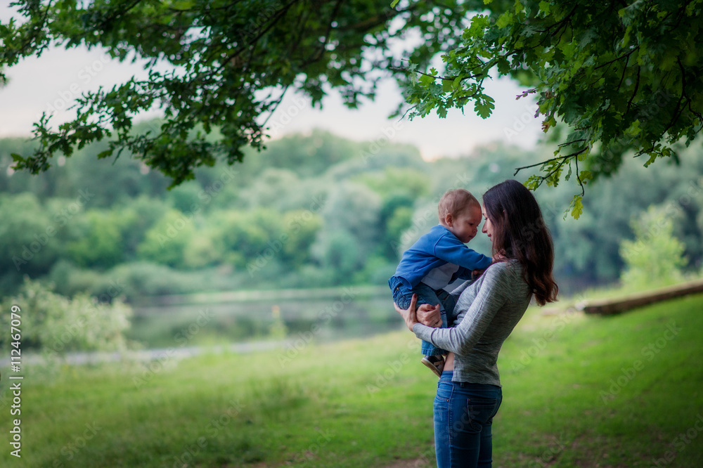 Fototapeta premium Mom turns her son for a walk