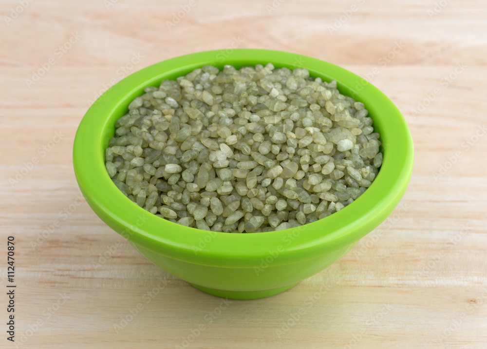 Bamboo rice in a small bowl on a wood table. Bamboo rice in a small bowl on a wood table.
