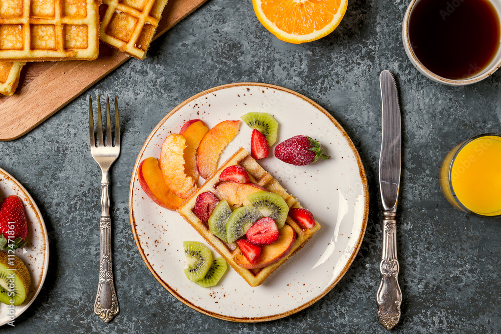 Breakfast waffles with fresh fruit.