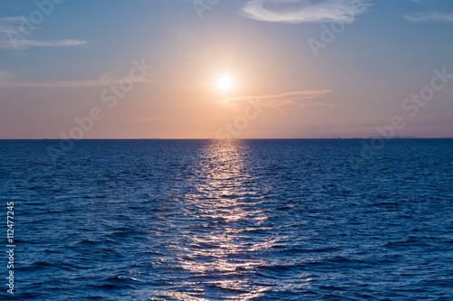Fototapeta Naklejka Na Ścianę i Meble -  Sunset over ocean skyline, natural landscape background