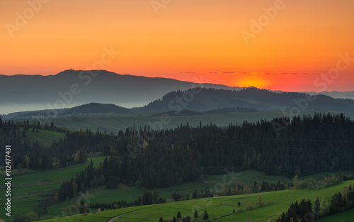 Moments before sunrise in misty Carpathian mountains  spring  Poland