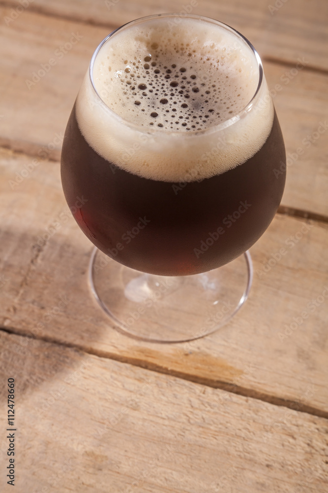 Dark beer on wood Dark beer on wood