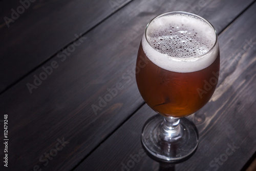 Amber ale on dark wood