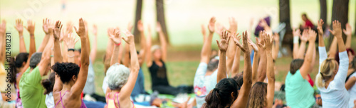 banner of hands up of people doing yoga