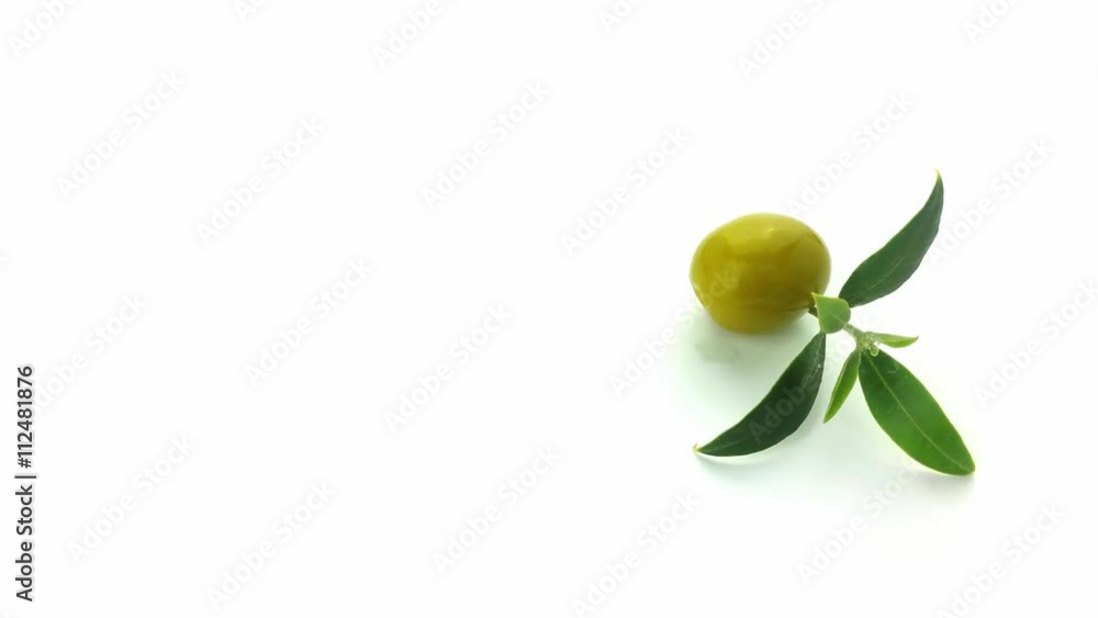 Olive with leaf turning on a white background, 4K UHD
