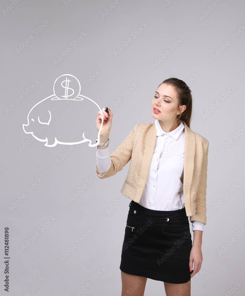 young woman drawing a piggy Bank young woman drawing a piggy Bank