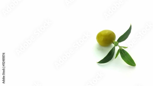 Olive with leaf turning on a white background, 4K UHD
