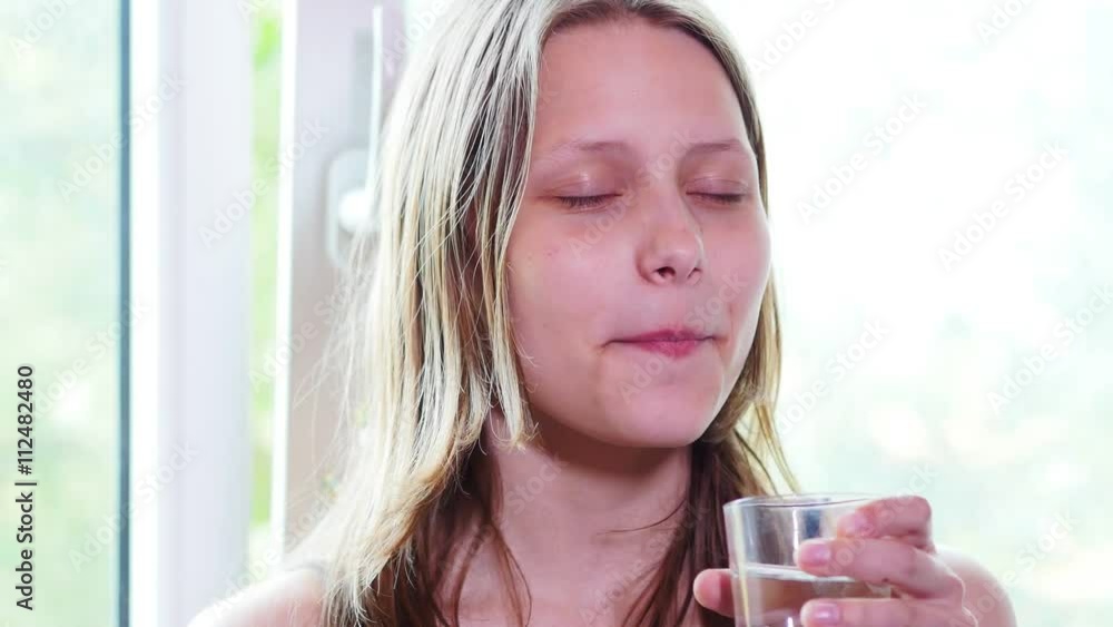Healthy Teen Girl Drinking Water from a glass. 4K UHD. Healthy Teen Girl Drinking Water from a glass. 4K UHD.