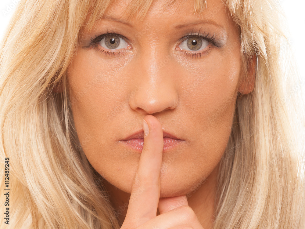 Woman asking for silence finger on lips hush gesture. Woman asking for silence finger on lips hush gesture.