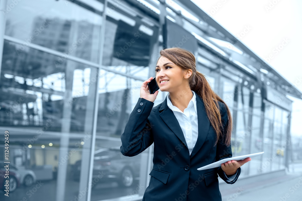 Successful businesswoman or entrepreneur using a digital tablet Successful businesswoman or entrepreneur using a digital tablet