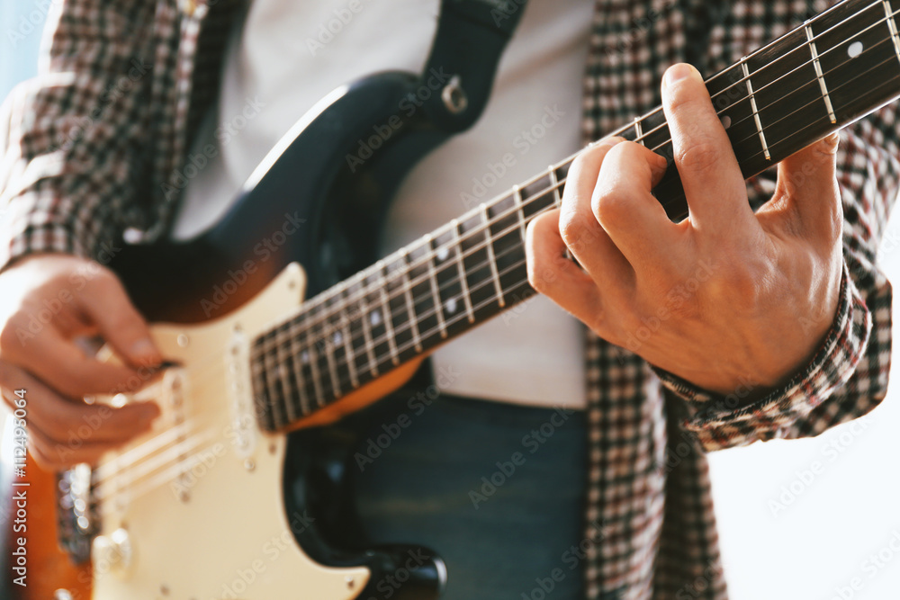 Fototapeta premium Man with guitar closeup