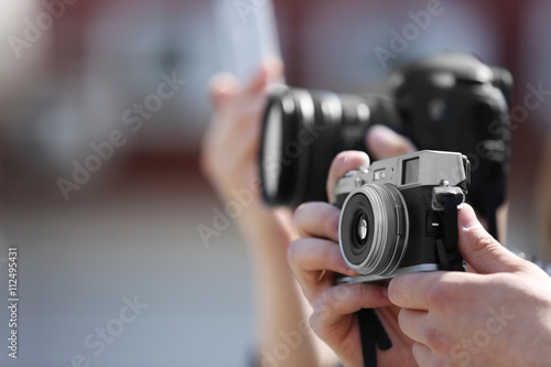 Male hands holding old camera, closeup