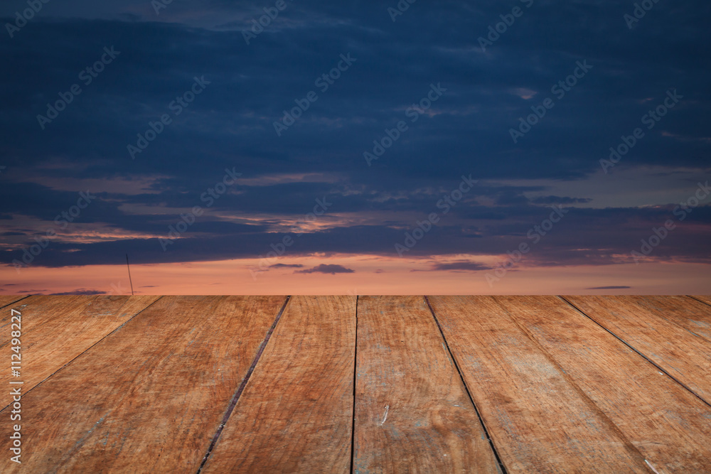 Perspective top wooden with sunrise on the lake