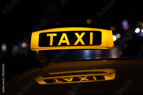 taxi sign at night , taxi cars
