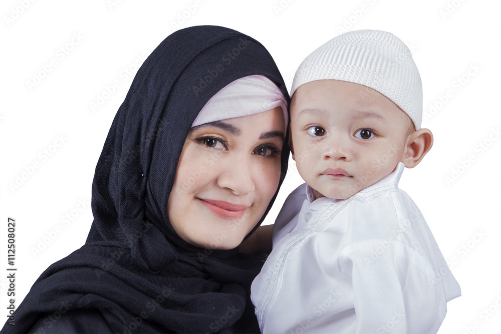Arabic woman with her son in studio Arabic woman with her son in studio