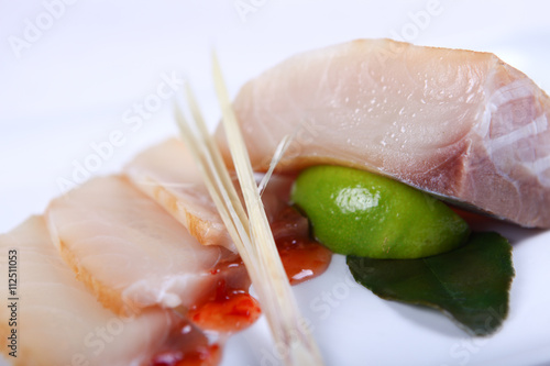 Raw white fish with sauce