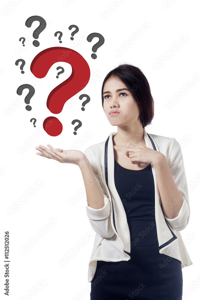Worker looking at red question sign Worker looking at red question sign