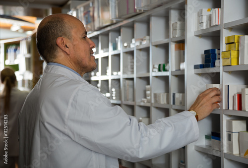 Wallpaper Mural male pharmacists working in farmacy Torontodigital.ca
