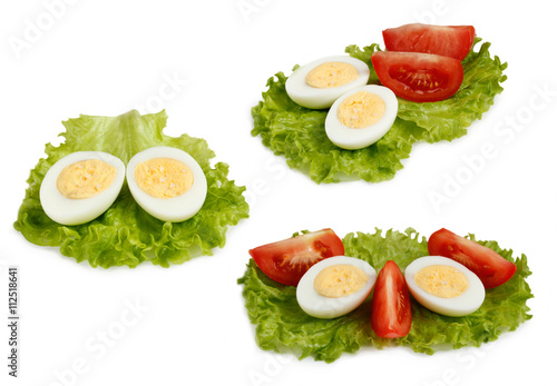 set half eggs and slices of tomato isolate on a white