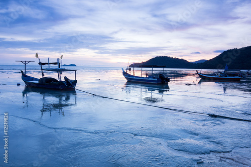Sunrise and Sunset with by the beach with a boat in Penang Malaysia © keongdagreat