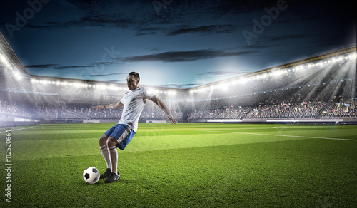 Soccer player hitting ball