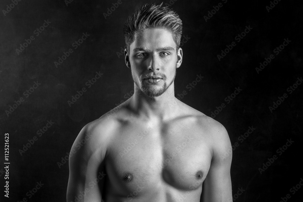 Fototapeta premium Handsome young and attractive man, male model. Shirtless male model. Black and white.