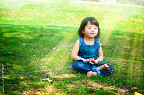 Meditating girl with light