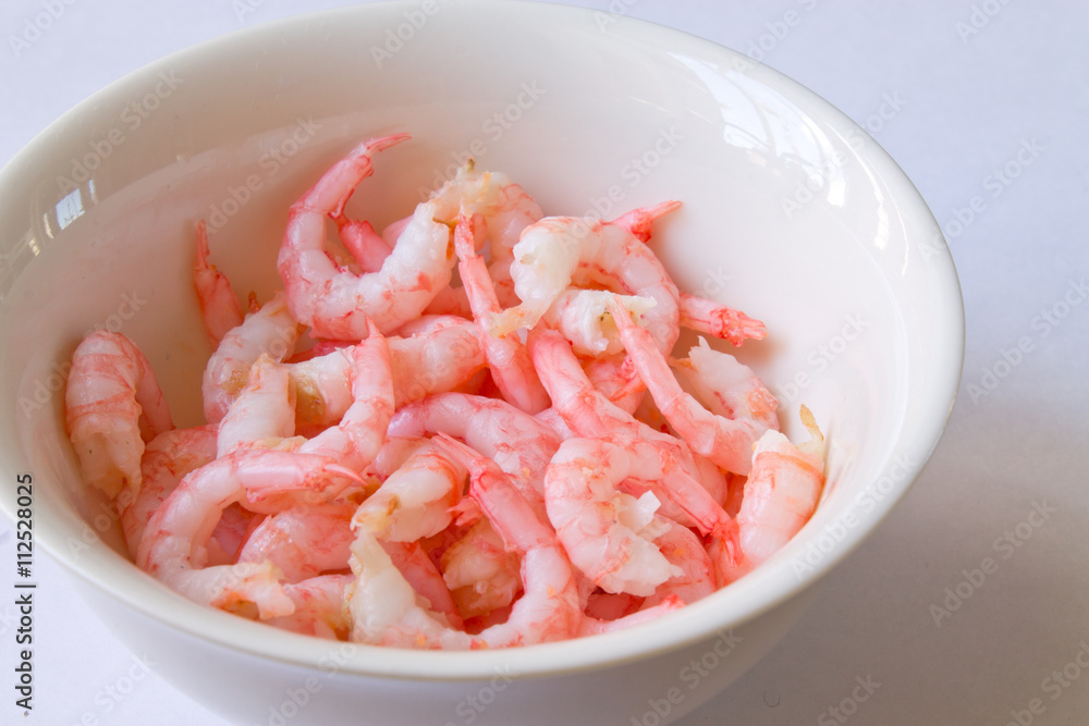 the shrimp in the bowl closeup on white background the shrimp in the bowl closeup on white background