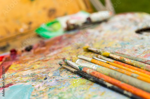 Close up of time-worn paintbrushes