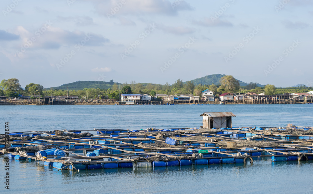 Scenery of a floating basket for keeping live fish in water sea in phuket,Thailand
