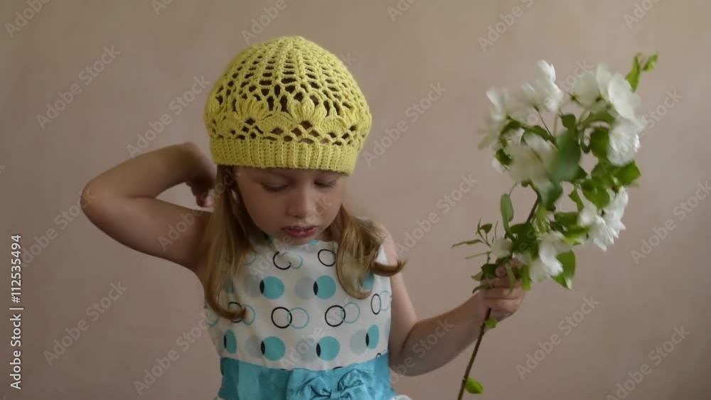 Little girl with an apple twig playing up Little girl with an apple twig playing up
