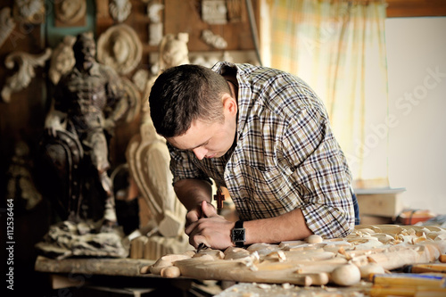 carver working in his workshop photo