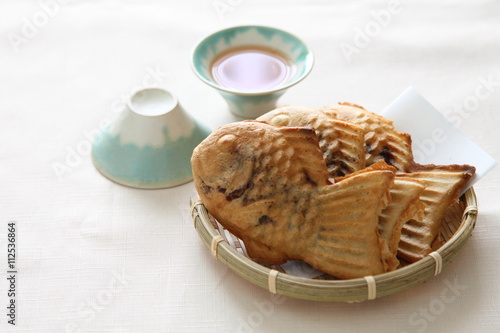 Japanese traditional sweet fish shaped pancake - TAIYAKI with Mt Fuji shaped cup