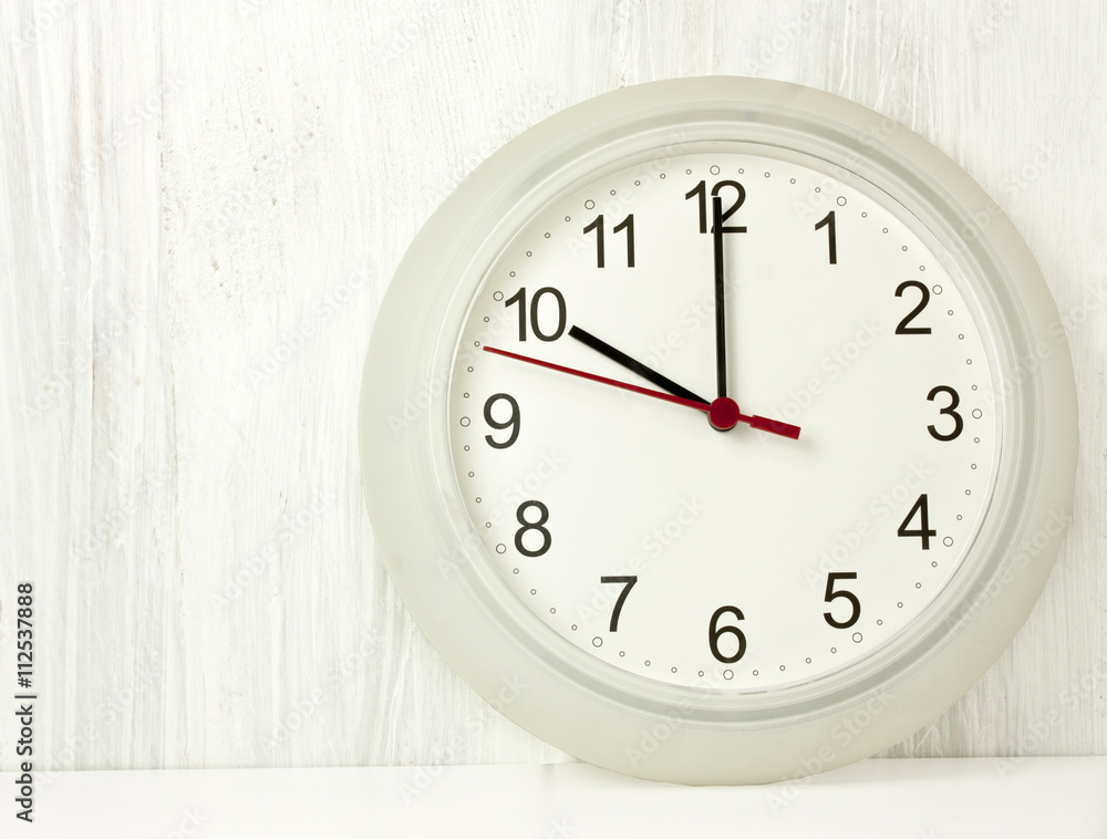 Typical office white clock with hands pointing at 10 Stock Photo ...