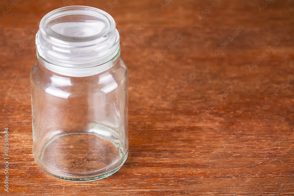Empty jar dark wooden background savings. Empty jar dark wooden background savings.