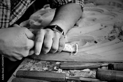 carvers Hands work with chisel in workshop