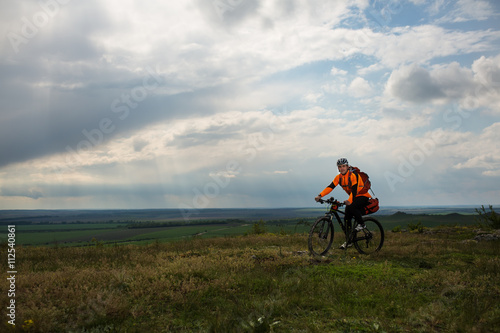 Young man is riding bicycle outside. Healthy Lifestyle. © Aleksey