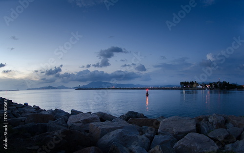 Boulders on the beach, beautiful blue evening in Mexico photo