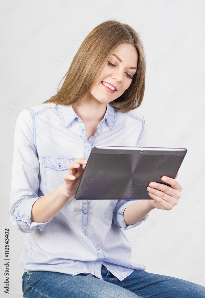 attractive girl with tablet in studio attractive girl with tablet in studio